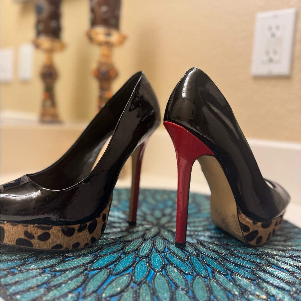 Elegant Black and Red High Heels with animal print platform